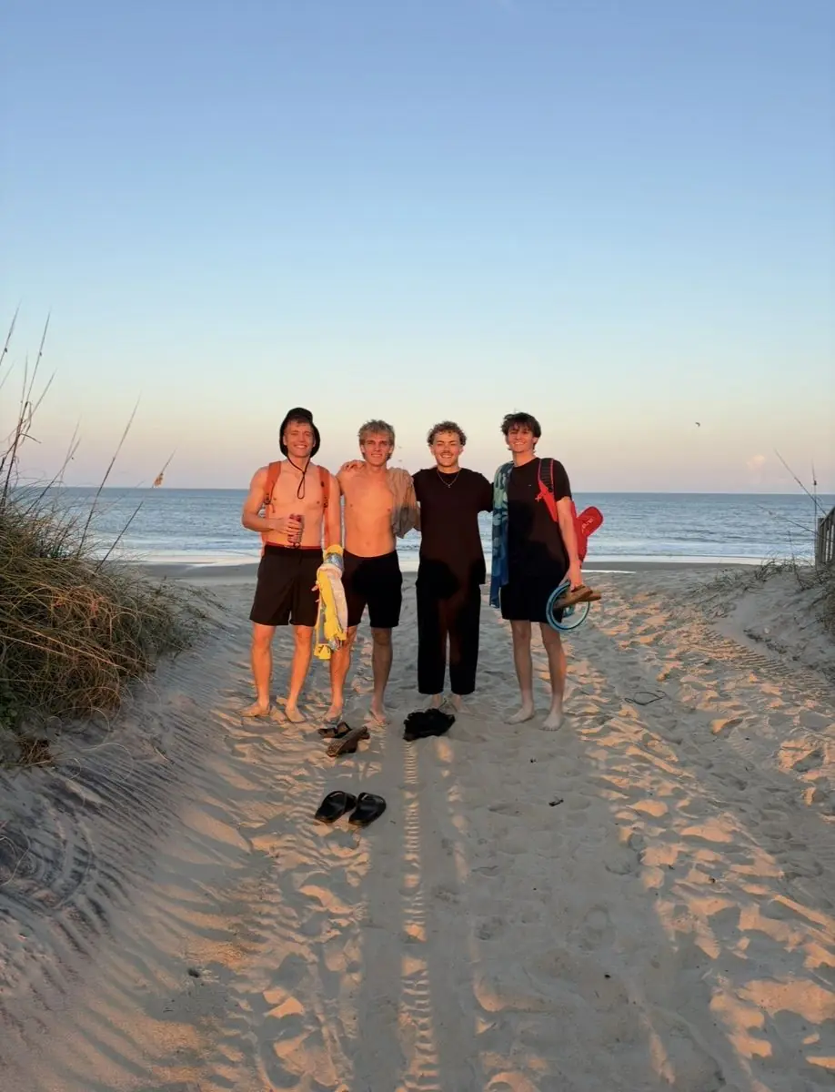 Four reps on the beach at sunset